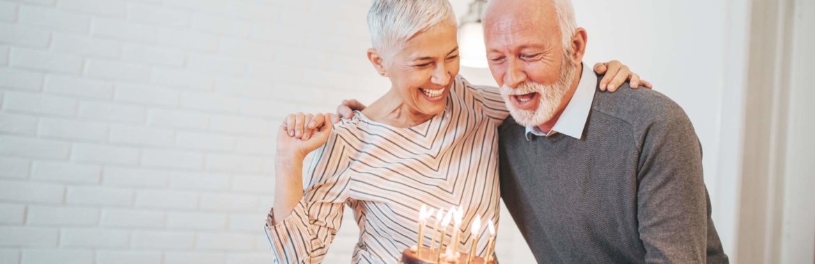 Medicare-eligible man celebrates his 65th birthday with his wife.