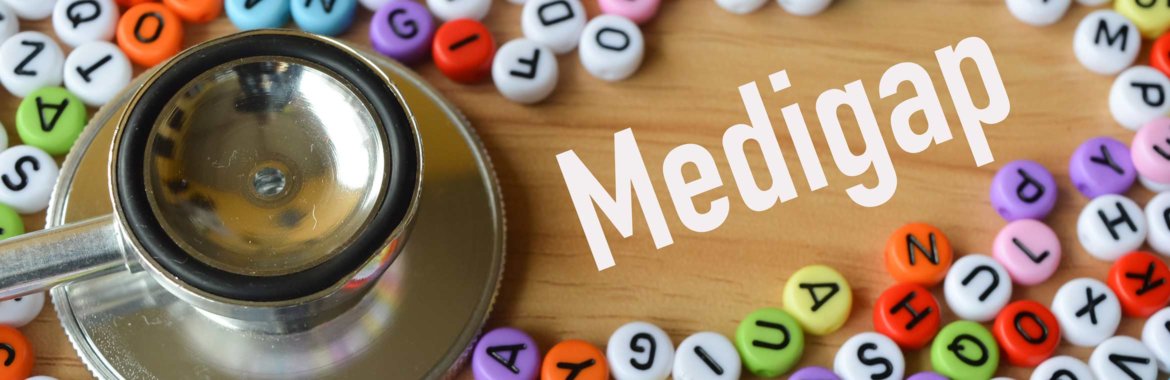 A stethoscope on a table next to the word "Medigap" and many lettered tiles.