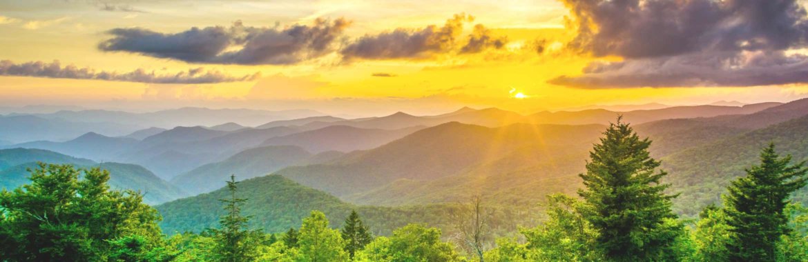 The sun sets over North Carolina's Blue Ridge mountain range.