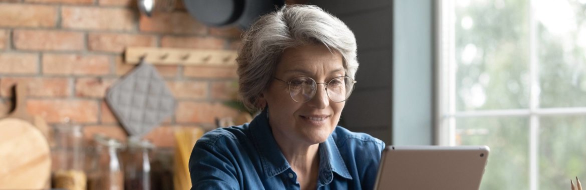 Medicare-age woman shops for healthcare on the Medicare website.