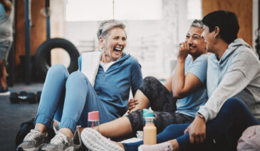 Group of people laughing at fitness class