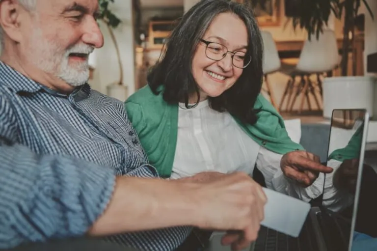 Man and woman at computer.