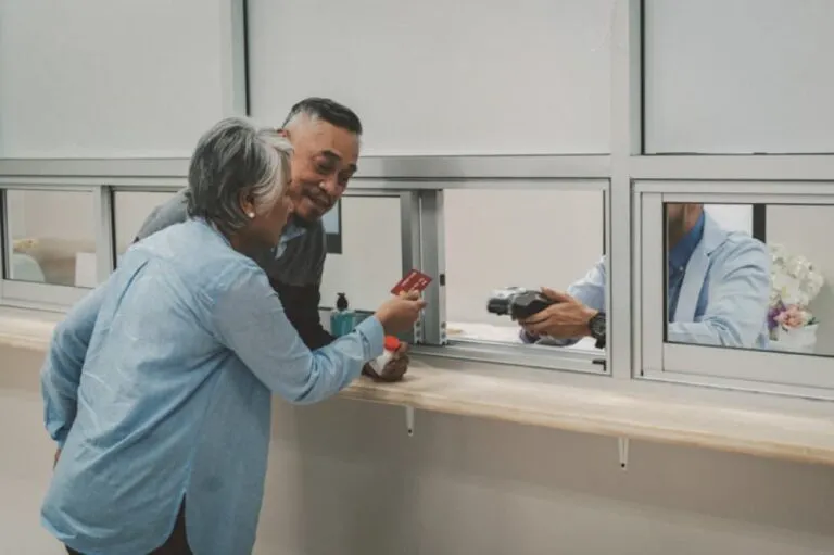 A senior couple is paying for their medication