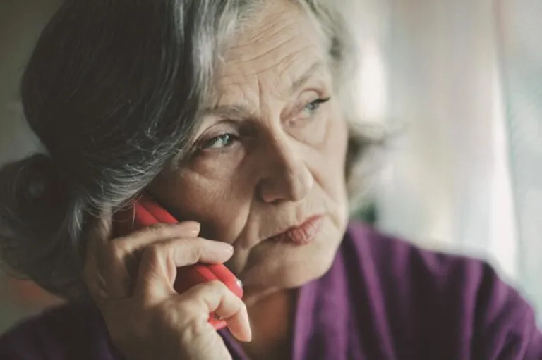A senior woman making a phone call