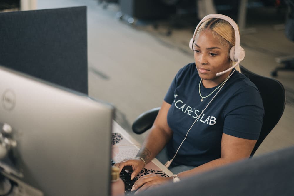 A licensed insurance agent working at her computer.