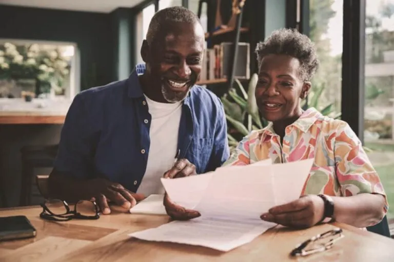 A senior couple looking at papers